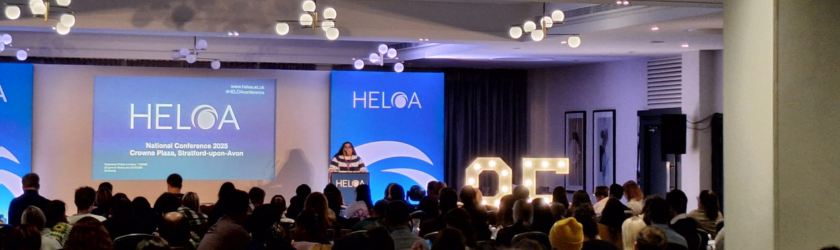 Reena Littlehales, HELOA Chair, addressing delegates on the stage at National Conference 2025